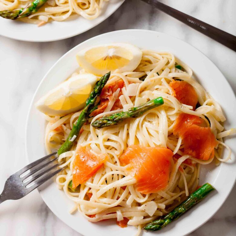 Overhead shot of freshly made lemon salmon pasta with asparagus.