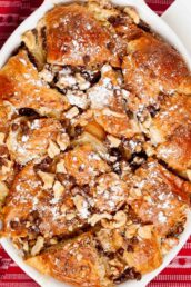 Overhead shot of a freshly baked Nutella bread pudding with chopped nuts.