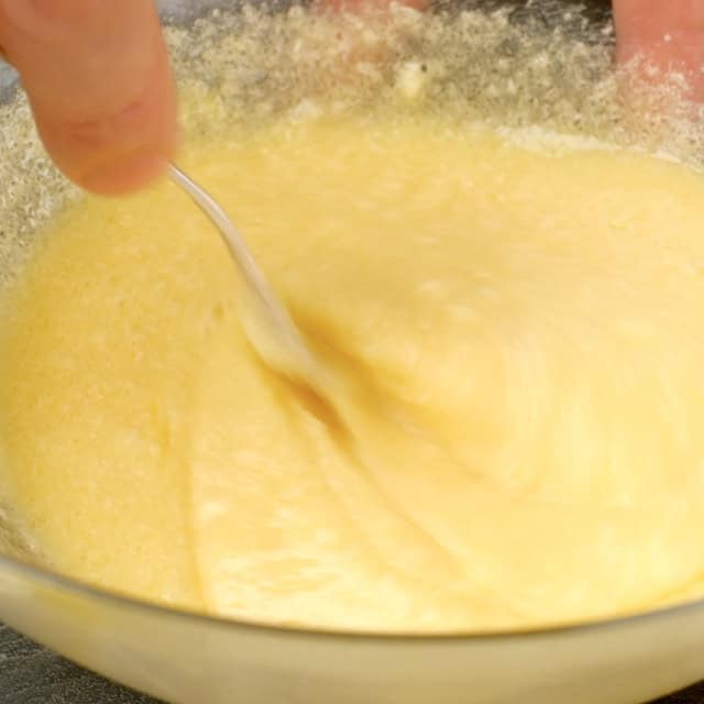Wet ingredients to make banana cake being whisked together.