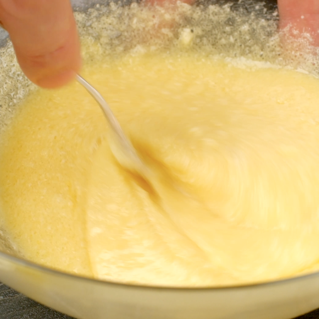 Wet ingredients to make banana cake being whisked together.