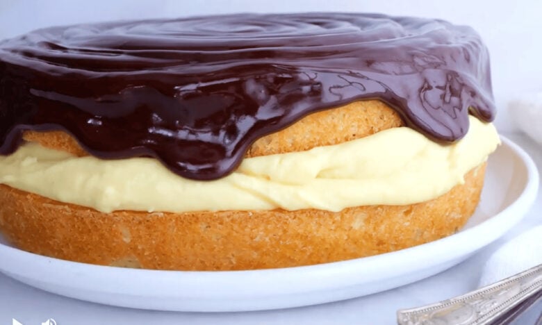 boston cream pie with chocolate sauce on top