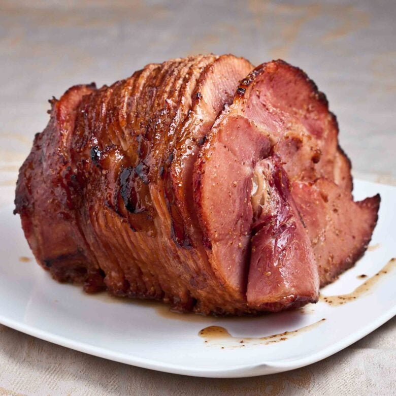 honey baked ham on a white plate. 