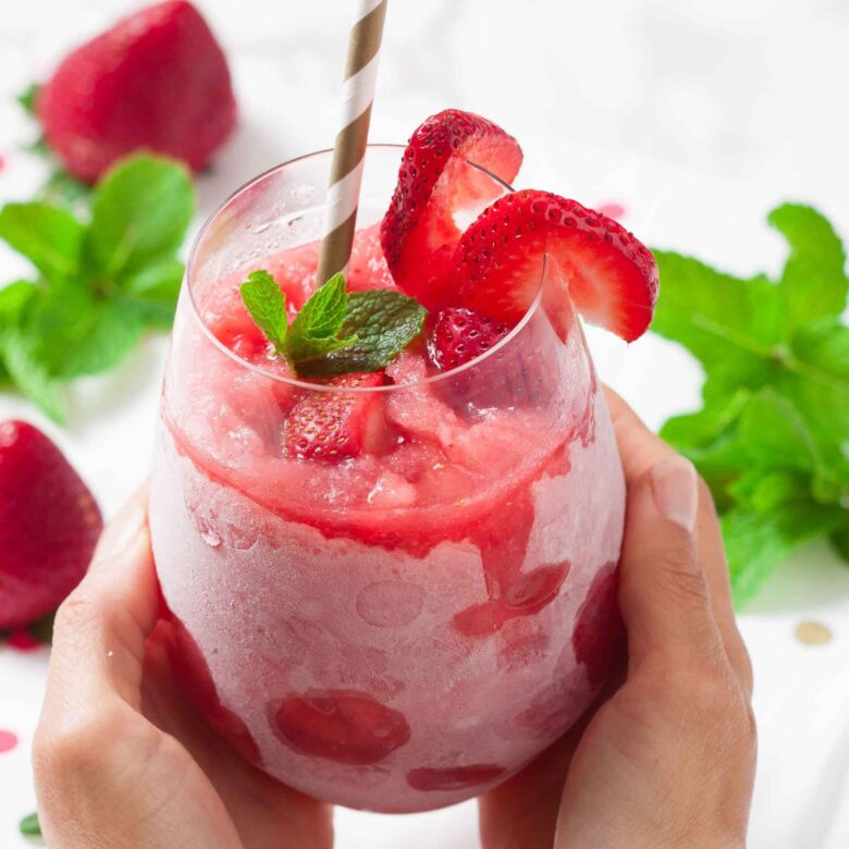Strawberry frosé garnished with mint, ready to serve.