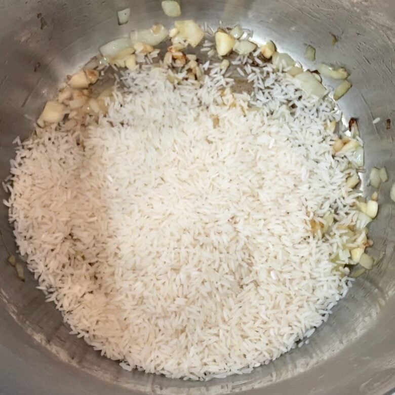 Rice added to instant pot to make instant pot mexican rice at home.