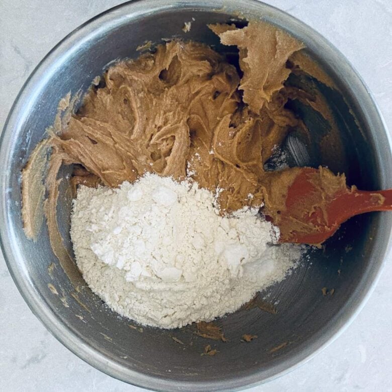 Flour added to peanut butter mixture to make chewy peanut butter cookies.