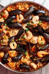 Overhead shot of easy seafood paella with fish, shrimp, and shell fish.