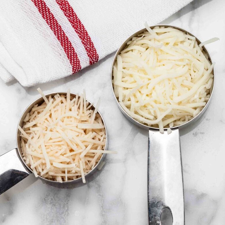 Shredded cheese to make spinach artichoke dip without mayo at home.