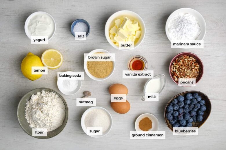 Overhead shot of ingredients to make blueberry coffee cake at home.