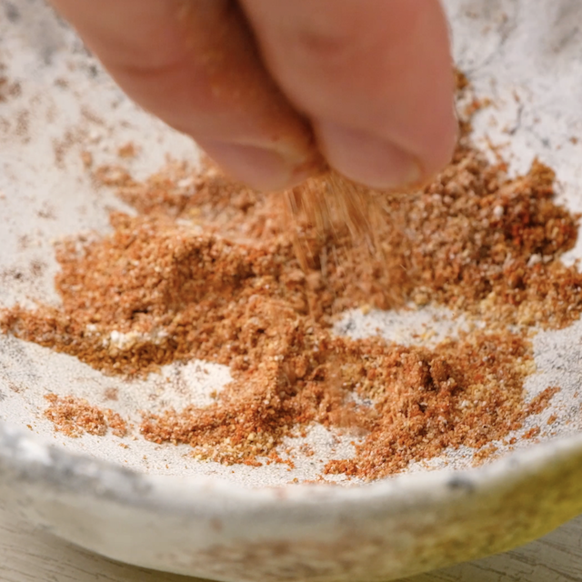 Seasoning mix being combined for pan seared tilapia.
