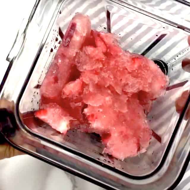 Frozen frosé mixture in a high speed blender, ready to be blended.