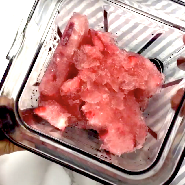 Frozen frosé mixture in a high speed blender, ready to be blended.