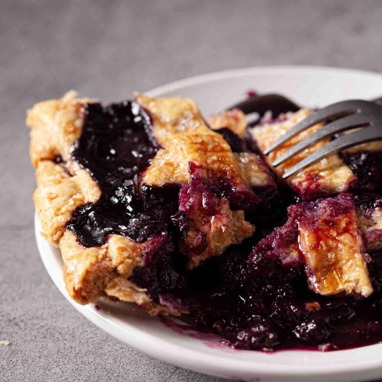 Closeup shot of a pie made using fresh blueberry pie filling recipe.