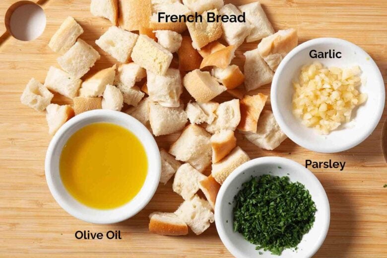 Overhead shot of ingredients to make garlic croutons at home.
