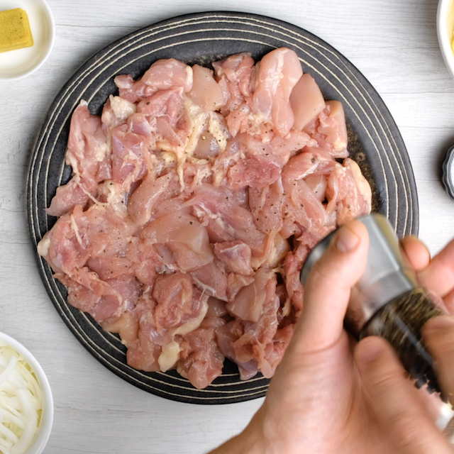 Chicken being seasoned to make Japanese chicken curry at home.