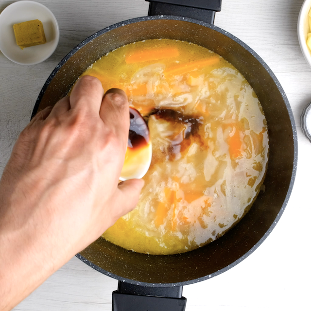 Tamari being added to Japanese chicken curry base.