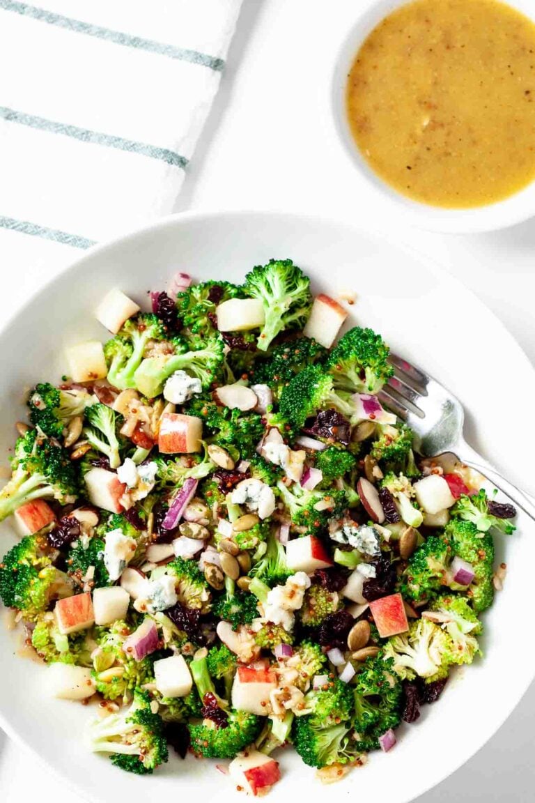 Overhead shot of homemade broccoli apple salad in a white dish.
