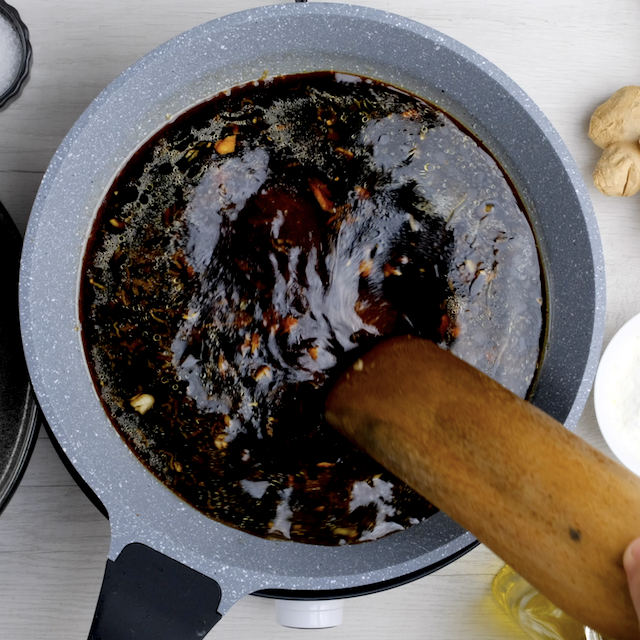 Mongolian beef sauce mixture being cooked in a pan.
