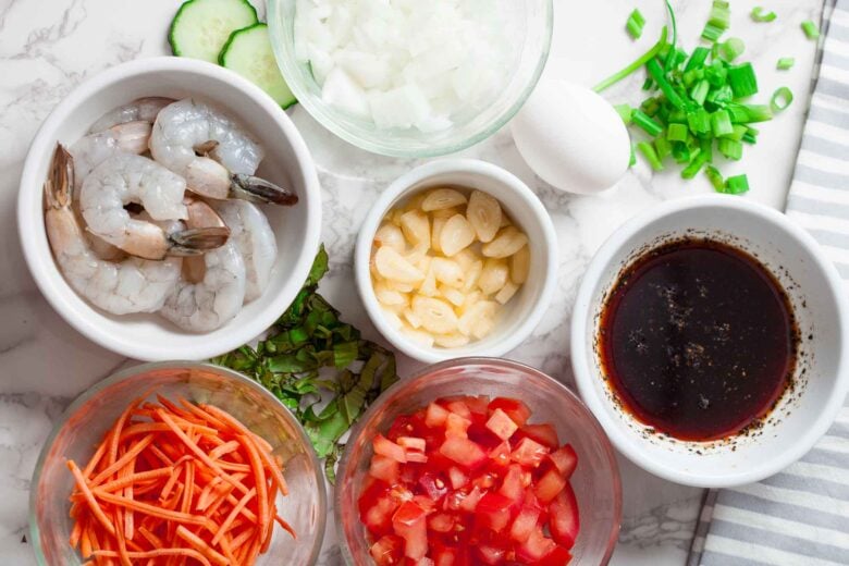 Overhead shot of ingredients to make Thai fried rice at home.