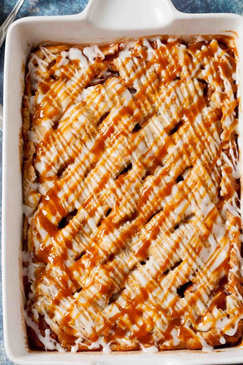 Overhead shot of apple pie bar casserole, drizzled with homemade salted caramel sauce.