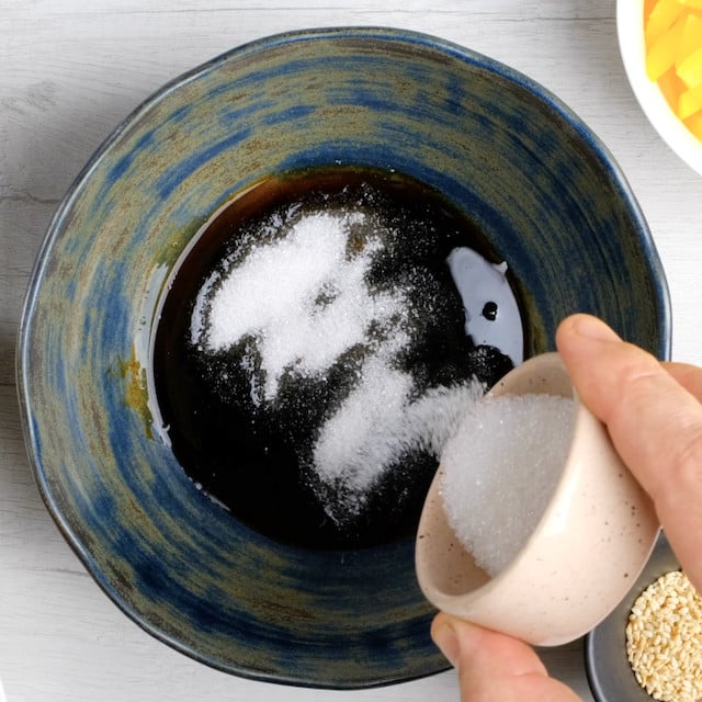 Sauce ingredients being combined to make lo mein noodles.