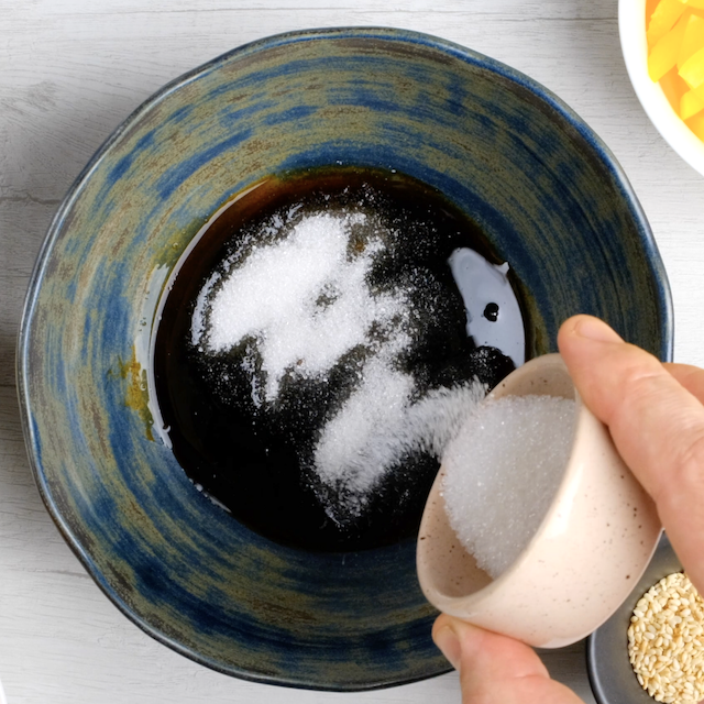 Sauce ingredients being combined to make lo mein noodles.