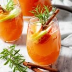 apple sangria with apple cider and slices of apples in a glass.