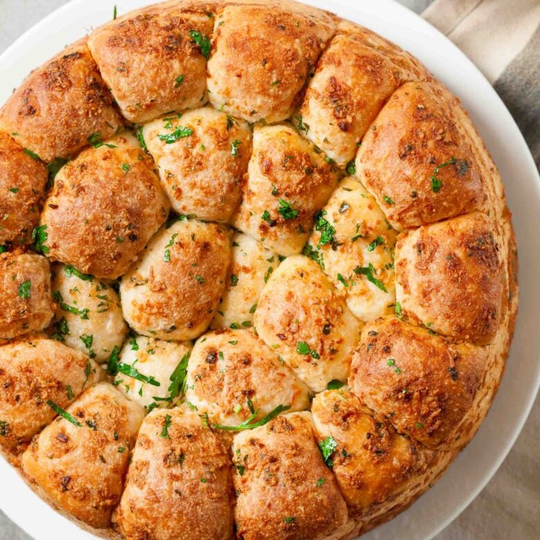 Overhead shot of freshly baked pull-apart rolls.