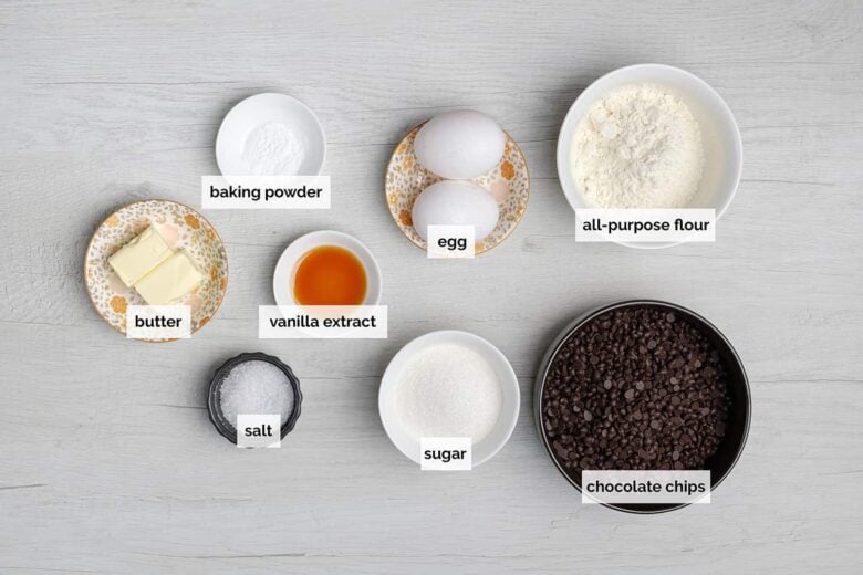 Ingredients to make brownie cookies on a light surface.