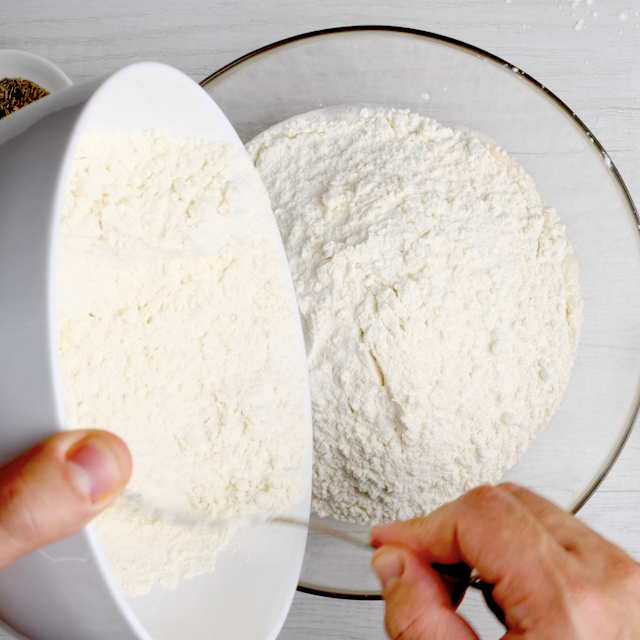 Flour mixture being added to yeast mixture.