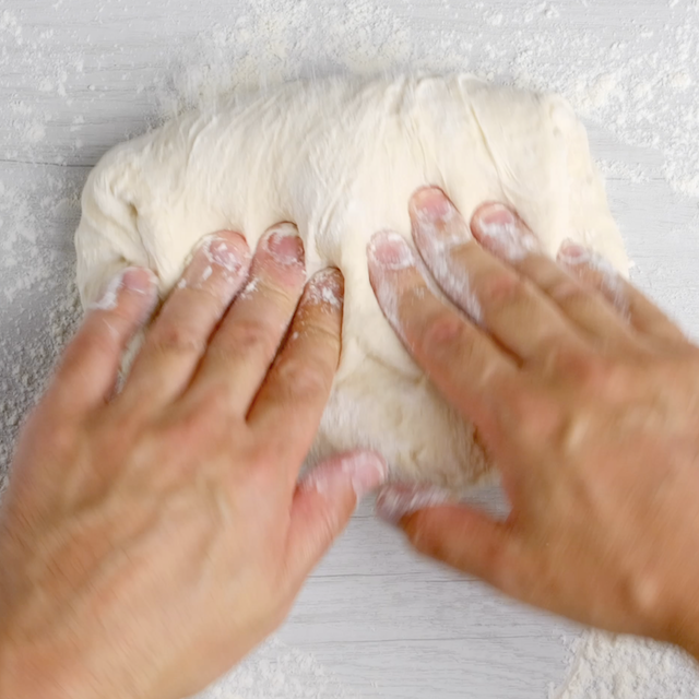 Olive garden breadstick dough being kneaded.