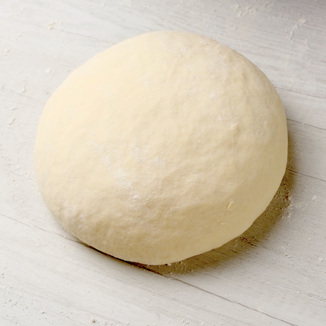 Olive garden breadstick dough on a white surface.