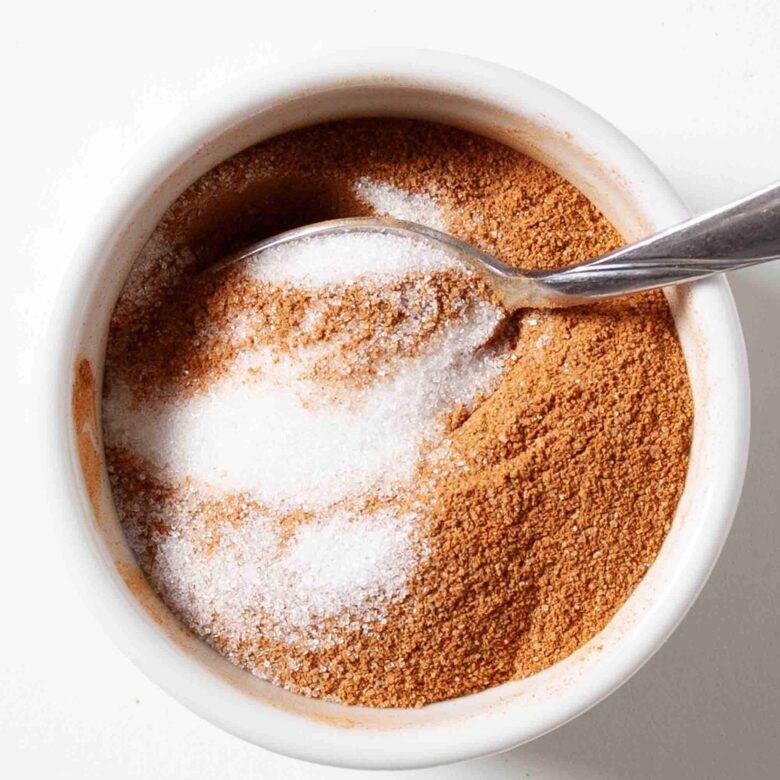 Cinnamon and sugar in a bowl to make topping for snickerdoodle bread.