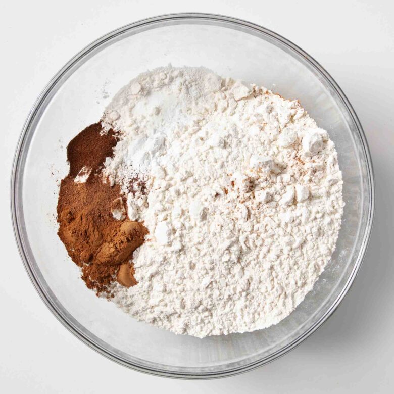Dry ingredients to make snickerdoodle bread in a glass bowl.