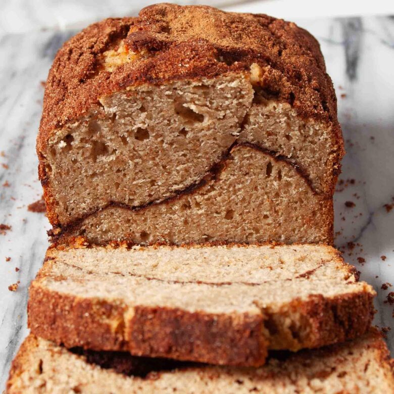 Closeup shot of a sliced homemade snickerdoodle bread loaf.