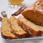 Closeup shot of sliced sweet potato bread with icing.