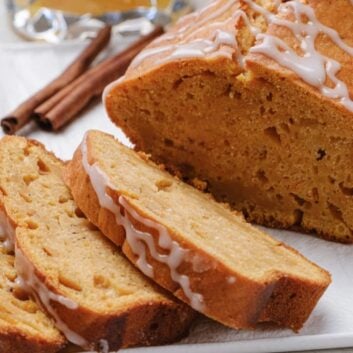 Closeup shot of sliced sweet potato bread with icing.