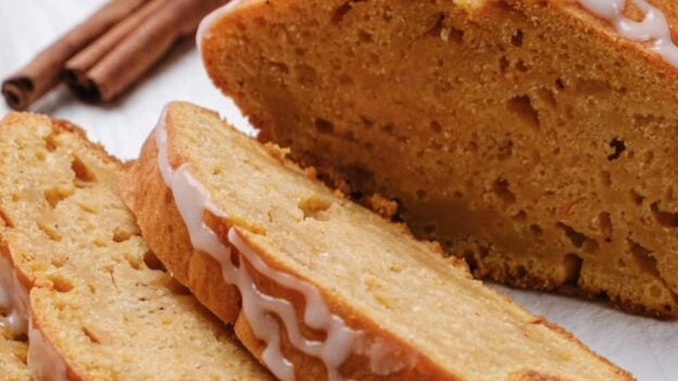 Closeup shot of sliced sweet potato bread with icing.