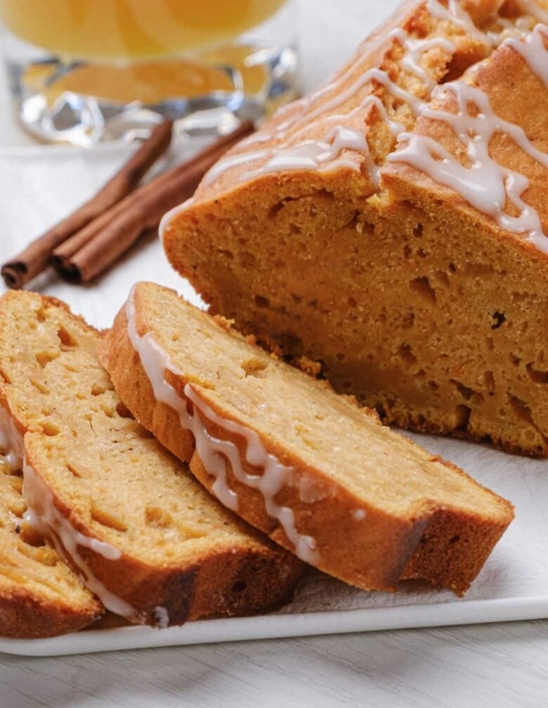 Closeup shot of sliced sweet potato bread with icing.