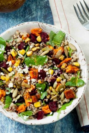Overhead shot of sweet potato quinoa salad with roasted sweet potatoes, beets, and fire roasted corn.