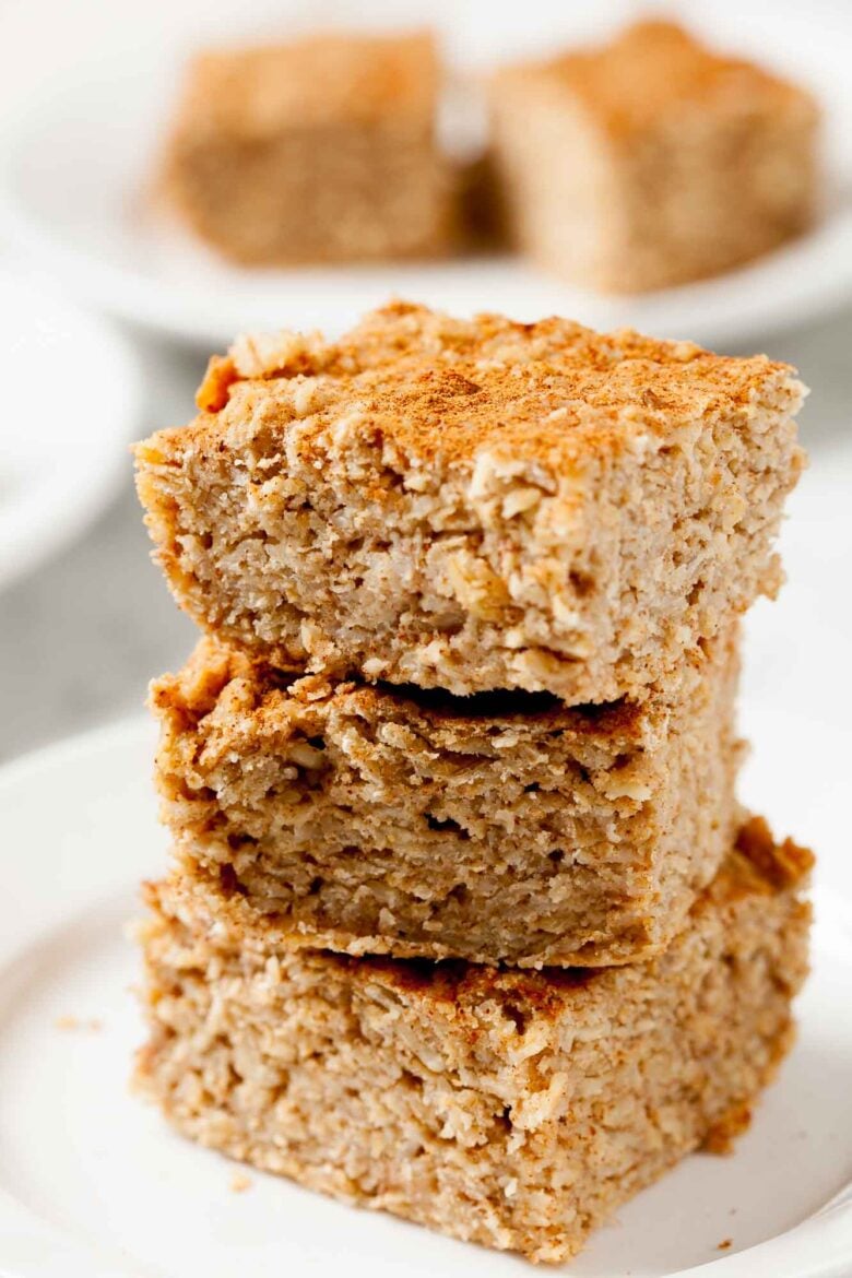 Closeup shot of three stacked apple oatmeal bars.