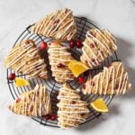 Cranberry orange scones drizzled with melted white chocolate.