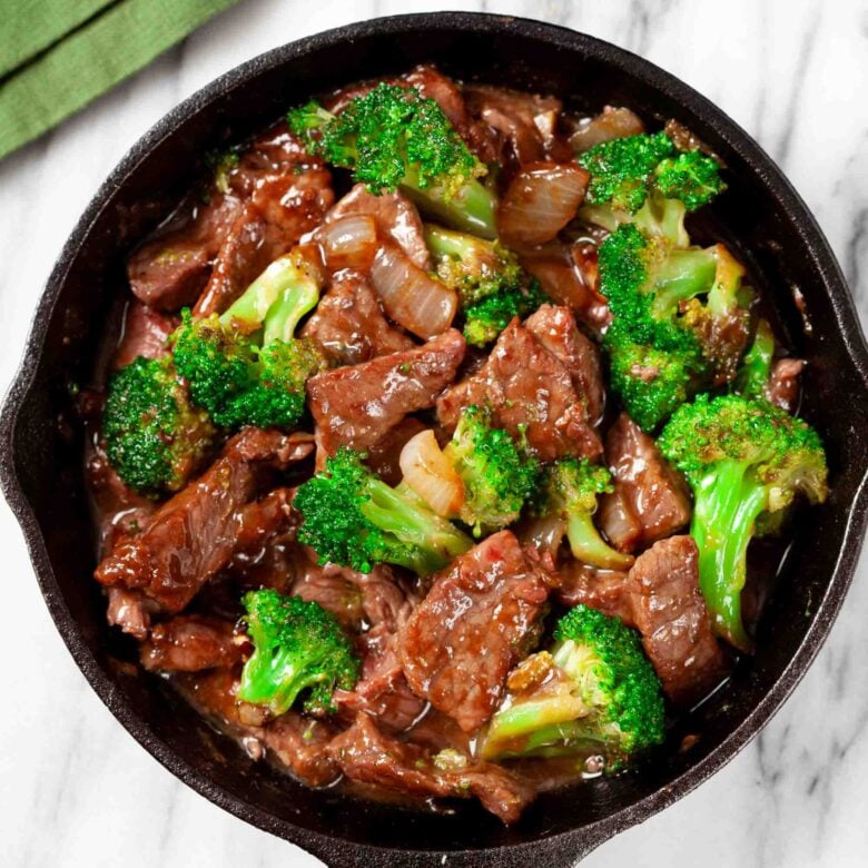 Overhead shot of a pan with homemade healthy beef and broccoli stir fry.