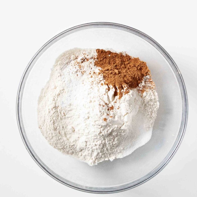 Dry ingredients for snickerdoodle bars in a glass bowl.