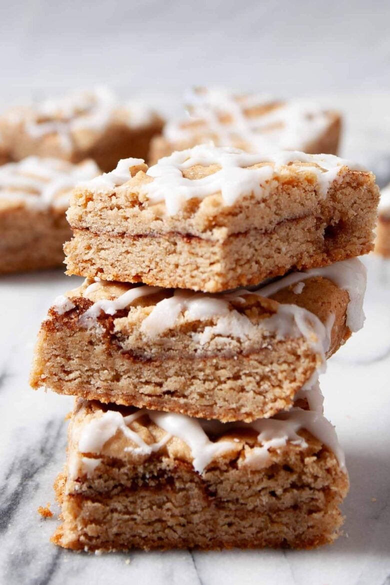 Closeup shot of snickerdoodle bars stacked on top of each other.