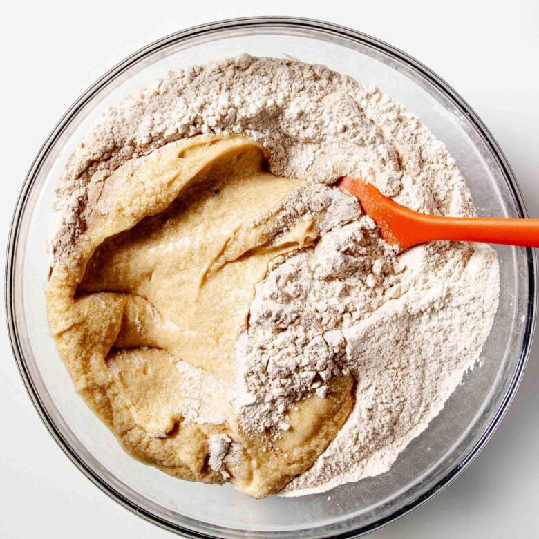 Dry and wet ingredients to make snickerdoodle bars being mixed together.