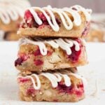white chocolate cranberry bars stacked.