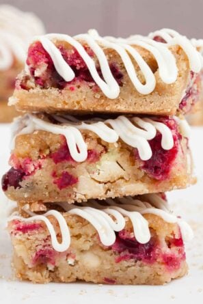 white chocolate cranberry bars stacked.