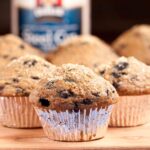 Closeup shot of blueberry steel cut oat muffins with visible blueberries.