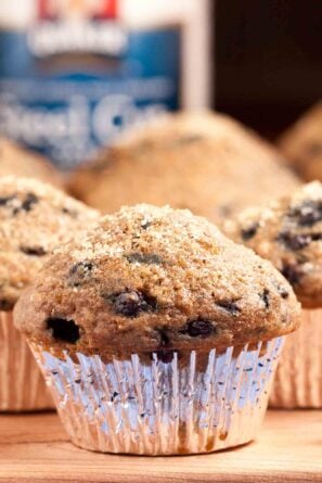 Closeup shot of blueberry steel cut oat muffins with visible blueberries.