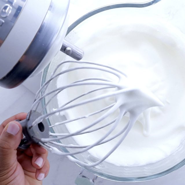 Egg whites at soft peaks stage.